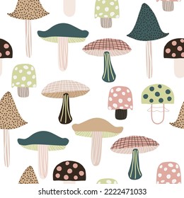 Seamless pattern with funny cartoon mushrooms. Autumn forest print. Vector hand drawn illustration.