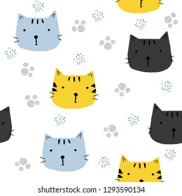 Seamless pattern with funny cats faces and footprints. Kids cute textile print. Vector hand drawn illustration.