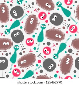 Seamless pattern with funny colorful monsters