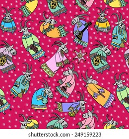 Seamless pattern with funny goats on a pink background