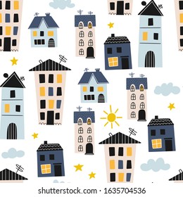 Seamless pattern with funny houses, clouds and sun in doodle style. Vector illustration for children. Suitable for textile, wallpaper, fabric.