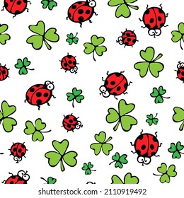 Seamless pattern with funny ladybugs and green lucky shamrock or clover leaves for St Patricks Day