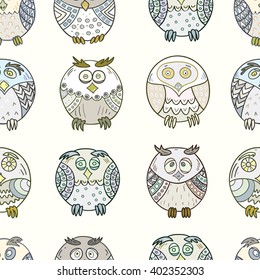 Seamless pattern of funny owls hand-drawn and colored . Vector graphics.