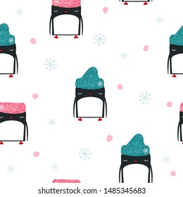Seamless pattern with funny penguins. Kids winter print. Vector hand drawn illustration.