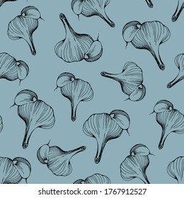 seamless pattern of garlic on a blue background.Garlic pattern for textile design, printing,and cooking blogs.Hand drawn vector illustration