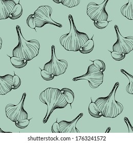  seamless pattern of garlic on a green background.Garlic pattern for textile and paper design. Hand-drawn vector.Head of garlic