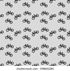 Seamless pattern with geometric shapes and symbols. Chaotically scattered bicycles. Vector texture or background pattern.