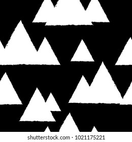 Seamless pattern with geometric snowy mountains. White triangles and black background. Vector illustration