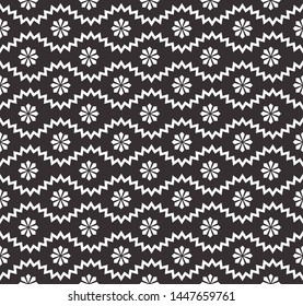 Seamless pattern with geometric zigzag and small flowers, snowflakes, stars. Abstract black and white texture. Simple monochrome background. Repeat design for decor, fabric, prints.