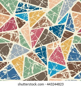 Seamless pattern with geometrical ornament. Colored triangles with shabby effect. Stylish print template for fabric and paper.