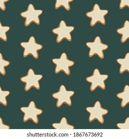 Seamless pattern of gingerbread cookies in the shape of stars with white icing on a green background