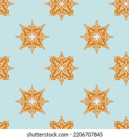 Seamless pattern of gingerbread in the form of snowflakes decorated with sugar icing. Background for packaging, invitations, fabrics and any design. Traditional background design.