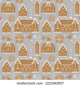 Seamless pattern of gingerbread houses. Vector illustration. For Christmas design, wrapping paper and fabrics.