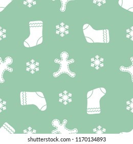 Seamless pattern with gingerbread man, christmas socks, snowflakes. Christmas and New Year 2019 background. Design for packaging paper, fabric and other print. 