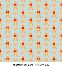 Seamless pattern of gingermen cookies and hearts with white icing as decoration. Great for textile print, holiday invitations or packaging. Vector file. 