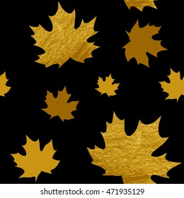 Seamless pattern with gold autumn leaves on a black background.