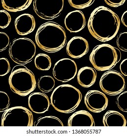Seamless pattern of gold hand drawn circles, elements on black background. Hand-drawn painted elements. Vector illustration.