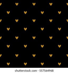 Seamless pattern with gold little hearts on black.