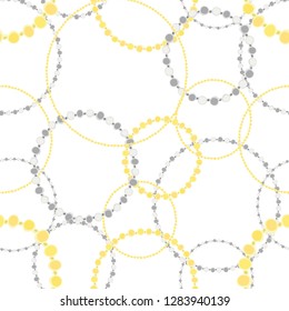 Seamless pattern of gold and silver chains. Set of gold and silver jewelry. Stylish wallpaper of gold and silver bracelets.
