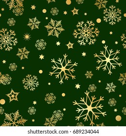 Seamless pattern of gold snowflakes on a dark background