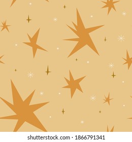 Seamless pattern with gold stars of different sizes on a yellow background and white snowflakes