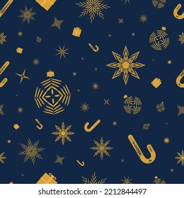 Seamless pattern with gold stars, snowflakes, christmas tree balls, caramel cane, presents on a dark blue background. Christmas and New Year pattern for gifts, wrappings, textile, backgrounds and wall