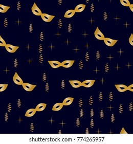 Seamless pattern of golden masks, streamers and stars on dark blue background. Costume party background