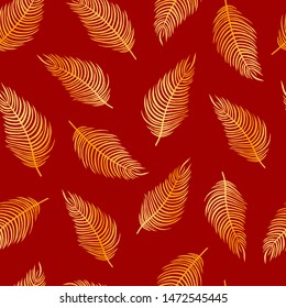 Seamless pattern of golden palm leaves on a red background
