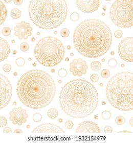 Seamless pattern with golden round mandalas on white background. Vector design.