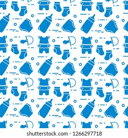 Seamless pattern with goods for babies. Newborn baby background. Baby bottle, nipple, socks, diapers, bodysuit.