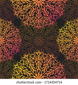 Seamless pattern of gradient yellow, orange, and pink mandalas on a dark background. Warm colored tribal vector illustration featuring bohemian geometric floral ornaments.