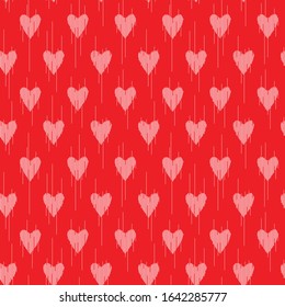 seamless pattern of graphic hearts on a red background