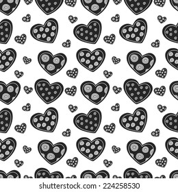 Seamless pattern of gray and black hearts on white background, vector texture for your design.