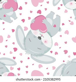 Seamless pattern with a gray bunny with a heart.