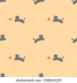 Seamless pattern of gray cat with orange knitting wool and white feather on yellow background.