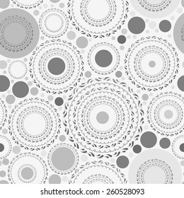 Seamless pattern with gray dots and circles on white background. Vector