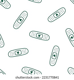 Seamless pattern with green band aid with heart