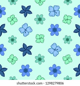Seamless pattern with green and blue exotic flowers on a light blue background.Tropical print for fabric,wrapping paper,wallpaper,planners,mugs,background for your design