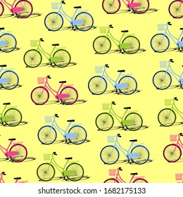 Patrón transparente de bicicleta verde, azul y rosa con sombra sobre fondo amarillo. Ilustración de verano o primavera en estilo plano.
