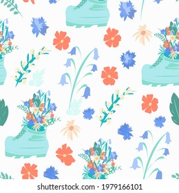 Seamless pattern with green borinki in which flowers of cornflowers, chamomile and bells grow. Pattern on a white background.