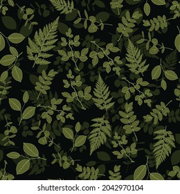 Seamless pattern. Green branches, leaves on a black background