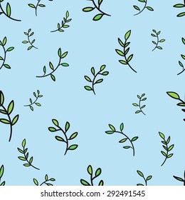 Seamless pattern of green branches on a blue background