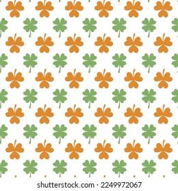 Seamless pattern with green and brown clover leaves