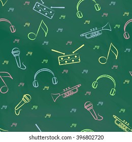 Seamless pattern green chalk board with colorful children's chalk drawings. Hand-drawn style. Seamless vector wallpaper with the image of  drum, microphone, pipe, headphones and note