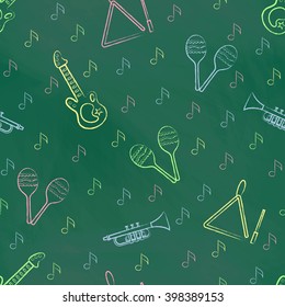 Seamless pattern green chalk board with color children's chalk drawings. Hand-drawn style. Seamless vector wallpaper with the image of musical instruments  maracas, guitar, musical triangle, note
