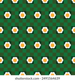 Seamless pattern with green checkerboard with daisies. 60's style. Design for packaging, background, wallpaper, t-shirt