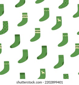 Seamless pattern of green Christmas socks on white background. Doodle style. Christmas winter background. Vector illustration