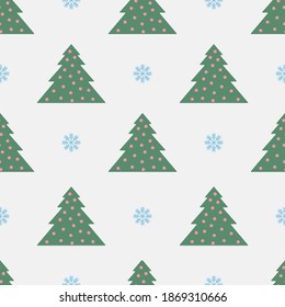El patrón impecable con los árboles verdes de Navidad y los copos azules de nieve está en el fondo plateado.
