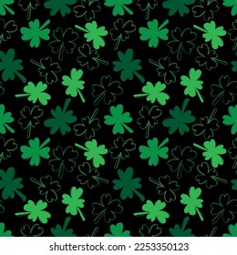 Seamless pattern with green clover isolated on black background. Hand drawn vector silhouette sketch illustration in doodle engraved vintage outline style. St. Patrick's day, lucky, botanical, plant.