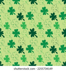 Seamless pattern with green clover isolated on salad background. Hand drawn vector silhouette sketch illustration in doodle engraved vintage outline style. St. Patrick's day, lucky, botanical, plant